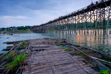 Kanchanaburi, Thailand - October 14, 2016: Old wooden bridge over the river (Mon Bridge) in Sangkhlaburi District, Kanchanaburi, Thailand. Photo taken on:14 October 2016のeditorial素材