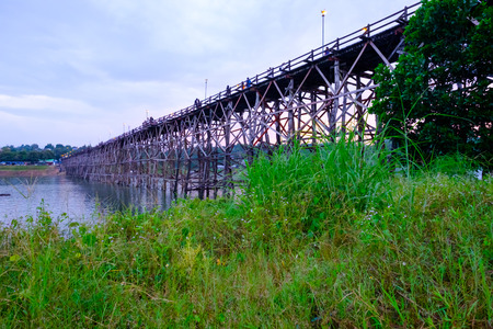 Kanchanaburi, Thailand - October 14, 2016: Old wooden bridge over the river (Mon Bridge) in Sangkhlaburi District, Kanchanaburi, Thailand. Photo taken on:14 October 2016のeditorial素材