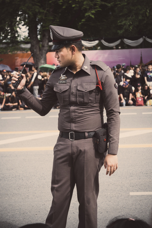 Bangkok, Thailand - October 22, 2016: Thai traffic police officer on duty outside the Grand Palace...