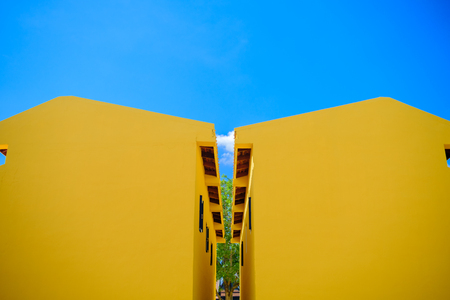 Kanchaburi, Thailand - November 12, 2016: Yellow House with blue sky in thailand ancient simulation park kanchanaburi. Photo taken on: 12 November 2016の写真素材