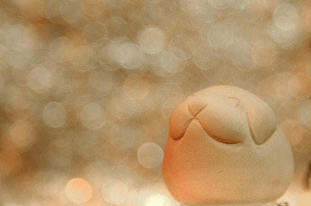Dog doll on abstract circular bokeh backgroundの写真素材