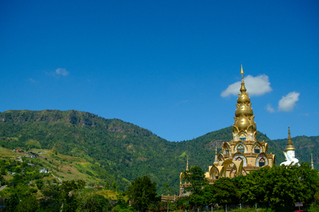Big White Buddha Statue with mountain and blue sky background at Wat Phasornkaew in Thailand. Photo taken on: 29 November , 2016の写真素材