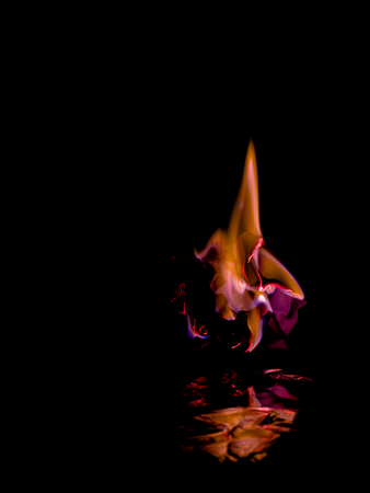 Beautiful concept flames. Fire on burns paper with black background. Soft Focusの写真素材