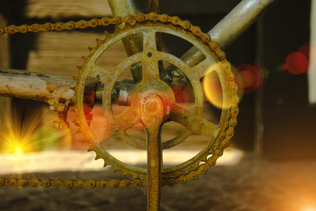 macro shot of some old rusty bike chain with lighting flare effectの写真素材