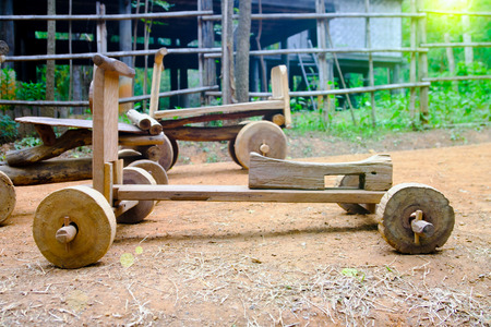 Wooden toy car sleigh  at countryside, Thailand.の写真素材