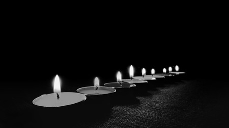 Black and white image and selective focus of Candle flame light at night with night background.の写真素材