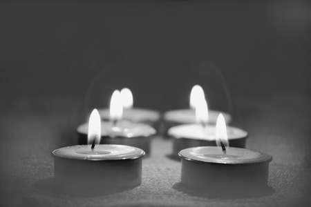 Black and white image and selective focus of Candle flame light at night with night background.の写真素材