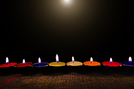Selective focus of Candle flame light at night with night background.の写真素材
