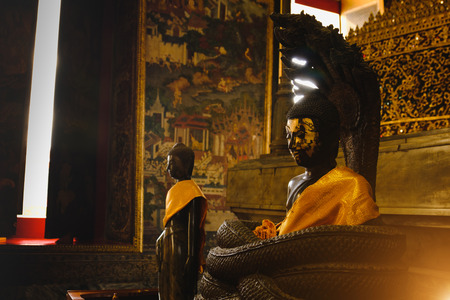 Buddha statue with thai art architecture in church Wat Suthat temple. This is a Buddhist temple in Bangkok .のeditorial素材