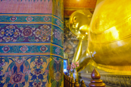 Reclining golden Buddha statue with thai art architecture in church Wat Pho (Temple of the Reclining Buddha) in Bangkok,Thailand.のeditorial素材