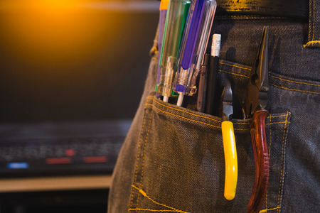 Set of engineer hand tools in jeans, A jeans with engineer constructor tools. Several engineer constructor tools on a denim workers.の写真素材