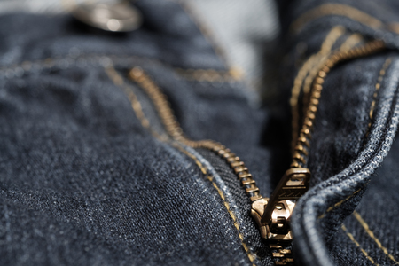 Jean with gold zipper. selected focus. background and textures.の写真素材