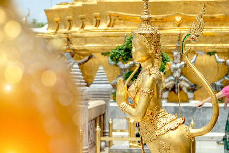 Golden angel statue of Temple of the Emerald Buddha (Wat pra kaew) and Grand palace ,Bangkok,Thailand.の写真素材