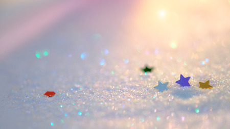 Background concept of little star on white sand with bokeh soft sunlight , selective and soft focus image .の写真素材