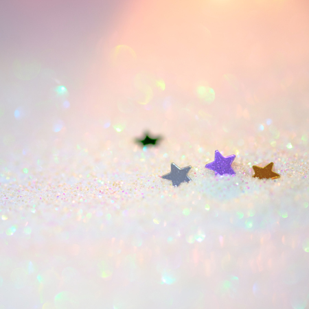 Background concept of little star on white sand with bokeh soft sunlight , selective and soft focus image .の写真素材
