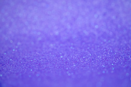 Bright and abstract blurred purple bokeh background with shimmering glitter?の写真素材