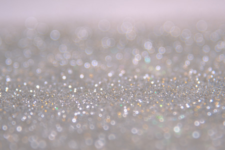 Silver and white bokeh lights defocused. abstract background.の写真素材