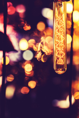 Decorative antique vintage edison style filament light bulbs in room.の写真素材