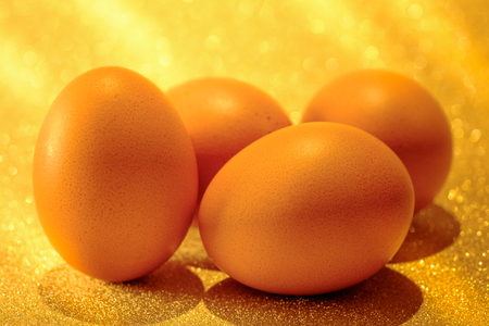 Fresh Eggs on golden light of golden bokeh background.  Golden heaven light Hope and success concept.の写真素材