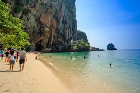 KRABI, THAILAND - December 16, 2017 : Tropical vacation holiday beach concept. tourist relaxing on Beautiful sea blue Railay beach, Krabi Thailand .のeditorial素材