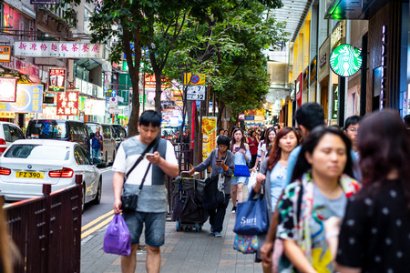 Hong Kong,China - April 24, 2018: Hong kong street scenery with crowed people and taxi.のeditorial素材