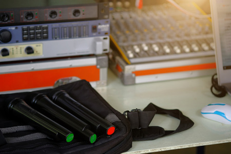 Close up microphone with blurred the sound mixer background.の写真素材