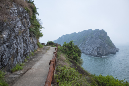 Vietnam, halong, catba. Rocky island in azure sea. Blue cloudless sky. Smaller islands in backgroundの写真素材