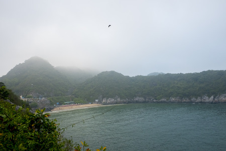 Vietnam, halong, catba. Rocky island in azure sea. Blue cloudless sky. Smaller islands in backgroundの写真素材
