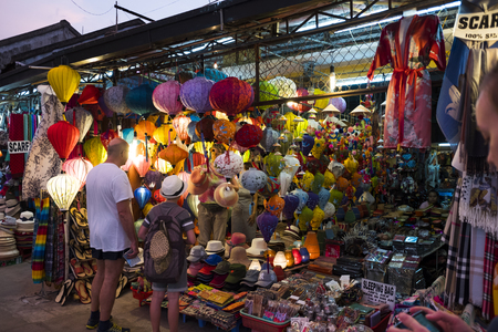 Lantern seller in the streets of ancient town of Hoi An in Central Vietnam, colorful lanterns hanging everywherのeditorial素材