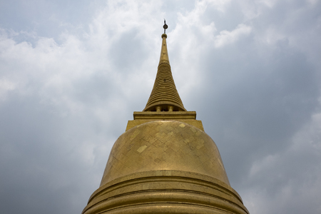 BANGKOK, THAILAND- MAY 11, 2017: Phu Khao Thong (Golden mountain) is under the blue sky. Phu Khao Thong is a steep artificial hill inside the Wat Saket compound.のeditorial素材