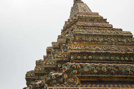 tower bangkok in the temple thailand abstract cross colors roof wat palaces asia sky and colors religion mosaic sculptureの写真素材