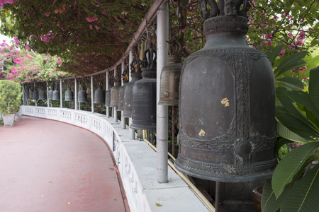 Bell ancient on the way of the Golden mount temple in the twilight of morning, Bangkok, Thailandの写真素材
