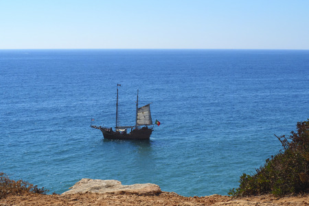 A view of a boat on Praia da Rocha in Portimao, Algarve region, Portugalのeditorial素材