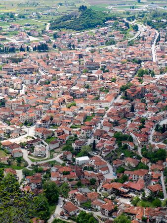 View of the red roofs of the Kalambaka town from the Meteora rocks, Greece.の写真素材