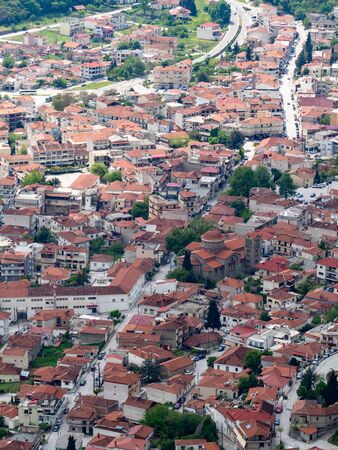 View of the red roofs of the Kalambaka town from the Meteora rocks, Greece.の写真素材