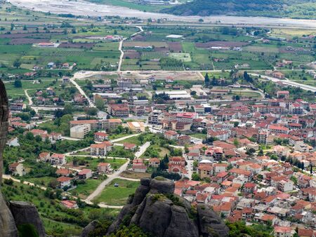 View of the red roofs of the Kalambaka town from the Meteora rocks, Greece.の写真素材