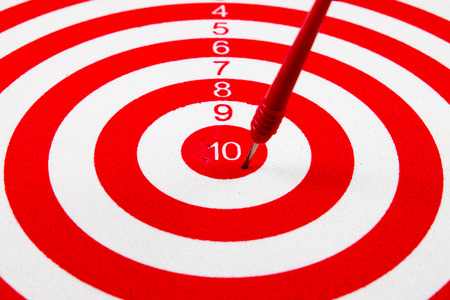Red dart target with red arrows  Close up