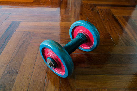 dumbells on wooden floorの写真素材