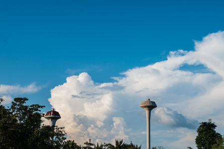 Two water tank tower On a cloudy skyの写真素材