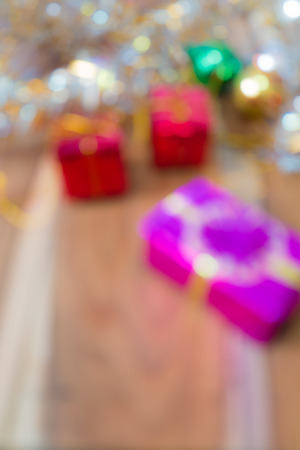 Defocused Christmas and New Year gift box abstract blurred Background for your design.の写真素材