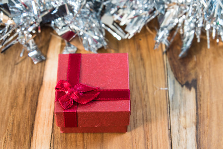 Gift box decorated for Christmas and New Year. On the background of wooden.の写真素材