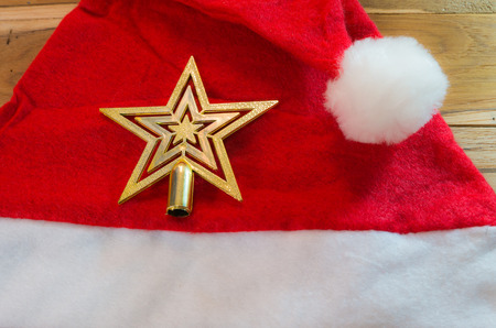 Christmas hat decorated for Christmas and New Year on a wooden floor.の写真素材