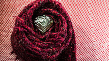Silver heart on scarves decorated for Valentine's Day. Love concept.の写真素材