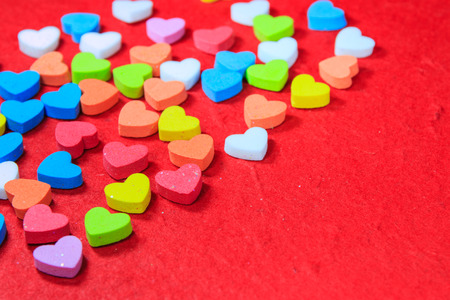 Valentines day background with colorful heart shaped on red paper.の写真素材