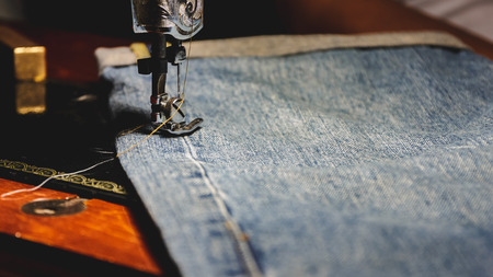 Sewing and jeans, Process color, Selective focus.の写真素材