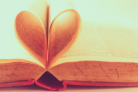 abstract blurred background of heart from book pages, vintage tone process.の写真素材