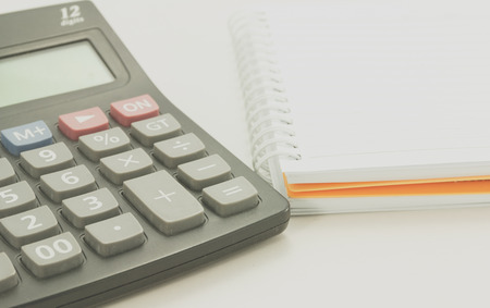 close up of calculator and note book, process color.の写真素材