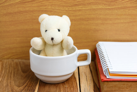 teddy bear in a coffee cup.の写真素材