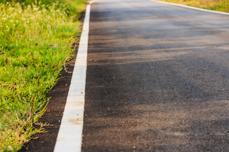white line on the road, selective focus, process color.