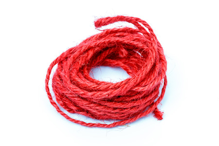 red rope roll on white background.